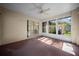 Enclosed sunroom with carpet flooring and lots of natural light at 4992 Nw 31St St, Ocala, FL 34482