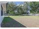 Expansive backyard featuring grass, mature trees, privacy fence, and a natural landscape at 5060 Ne 4Th St, Ocala, FL 34470