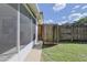 A convenient outdoor wooden shower in the backyard for rinsing off after outdoor activities at 5060 Ne 4Th St, Ocala, FL 34470