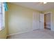 Empty bedroom with carpet flooring, closet and window at 5060 Ne 4Th St, Ocala, FL 34470