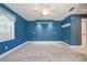 Spacious bedroom with overhead fan and carpeted floors at 5060 Ne 4Th St, Ocala, FL 34470