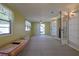 Bonus room with carpet, access to the backyard, and a unique canoe feature at 5060 Ne 4Th St, Ocala, FL 34470
