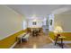 The dining room features a ceiling fan, natural lighting, and flows into the kitchen at 5060 Ne 4Th St, Ocala, FL 34470