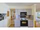 Traditional kitchen with stainless steel microwave and smooth cooktop at 5060 Ne 4Th St, Ocala, FL 34470