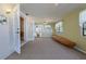 Bright living room featuring neutral decor, french doors, and a ceiling fan at 5060 Ne 4Th St, Ocala, FL 34470