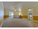 Open-concept living room flows into the dining area, complete with carpet and natural light at 5060 Ne 4Th St, Ocala, FL 34470