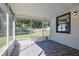 The screened porch provides an excellent place to enjoy the outdoors while staying protected from insects at 5060 Ne 4Th St, Ocala, FL 34470
