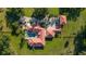 Aerial view of a grand estate featuring lush landscaping and a luxurious pool area at 6381 Sw 21St Court Rd, Ocala, FL 34471