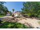 Picturesque backyard with a gazebo, a tranquil pond, and meticulously maintained landscaping, ideal for relaxation at 6381 Sw 21St Court Rd, Ocala, FL 34471
