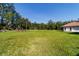 Expansive backyard with mature trees and well-maintained lawn at 6381 Sw 21St Court Rd, Ocala, FL 34471