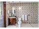 Modern bathroom with mosaic tile wall, floating vanity, and glass bowl sink at 6381 Sw 21St Court Rd, Ocala, FL 34471