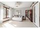 Sun-filled bedroom with daybed, elegant mirror, and doorway at 6381 Sw 21St Court Rd, Ocala, FL 34471