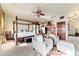 Comfortable bedroom suite with a cozy seating area, kitchenette, and abundant natural light at 6381 Sw 21St Court Rd, Ocala, FL 34471