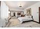 Bright bedroom showcasing a mirrored wall, providing ample light and space at 6381 Sw 21St Court Rd, Ocala, FL 34471