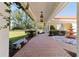 Charming covered walkway with brick pavers, leading to a landscaped garden and a serene outdoor space at 6381 Sw 21St Court Rd, Ocala, FL 34471