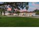 Stunning white home featuring a red tile roof, expansive lawn and circular driveway at 6381 Sw 21St Court Rd, Ocala, FL 34471
