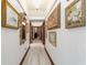 Hallway adorned with decorative art, and wood trim doors at 6381 Sw 21St Court Rd, Ocala, FL 34471