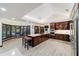 Spacious kitchen with dark cabinets, large island, stainless steel appliances, and adjacent bay window at 6381 Sw 21St Court Rd, Ocala, FL 34471