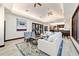 Bright living room with comfortable seating, stylish decor, and a view of the open concept kitchen at 6381 Sw 21St Court Rd, Ocala, FL 34471
