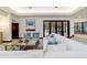 Comfortable living room with stylish decor, comfortable seating, and bright natural lighting at 6381 Sw 21St Court Rd, Ocala, FL 34471