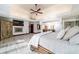 Well-lit main bedroom featuring a fireplace and wooden accents at 6381 Sw 21St Court Rd, Ocala, FL 34471