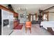 Spacious main bedroom featuring a kitchenette, sitting area, and four poster bed at 6381 Sw 21St Court Rd, Ocala, FL 34471