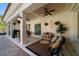Covered patio with comfortable seating and decorative plants, creating an inviting outdoor living space for relaxing and entertaining at 6381 Sw 21St Court Rd, Ocala, FL 34471