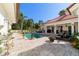 Backyard features a pool, outdoor seating, and lush landscaping, creating a tranquil and private outdoor space at 6381 Sw 21St Court Rd, Ocala, FL 34471