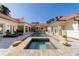 Backyard features a large pool with a hot tub and a spacious patio area, perfect for outdoor living at 6381 Sw 21St Court Rd, Ocala, FL 34471