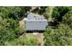 An aerial view of home with well-maintained roof and mature trees on all sides providing nice shade at 645 Sw 48Th Ln, Ocala, FL 34471