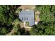 An aerial view of home featuring mature trees and a well manicured lawn in a quiet neighborhood at 645 Sw 48Th Ln, Ocala, FL 34471