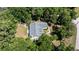 Aerial view of a well-maintained property with a home, fenced yard, and surrounded by mature trees at 645 Sw 48Th Ln, Ocala, FL 34471