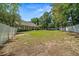 Expansive backyard with a white fence, offering privacy and plenty of space for outdoor activities at 645 Sw 48Th Ln, Ocala, FL 34471