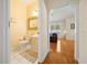 Half bathroom featuring neutral walls, tile floors, and a decorative mirror at 645 Sw 48Th Ln, Ocala, FL 34471