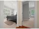 Comfortable bedroom features neutral walls, plush carpet, and access to an adjoining room at 645 Sw 48Th Ln, Ocala, FL 34471
