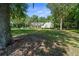 Charming home with a manicured lawn, mature trees, and a welcoming front porch with dormer windows at 645 Sw 48Th Ln, Ocala, FL 34471