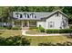Inviting single-Gathering home featuring a covered porch and well-maintained landscaping creating great curb appeal at 645 Sw 48Th Ln, Ocala, FL 34471