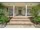 Charming home featuring a welcoming front entrance with brick steps and classic architectural details at 645 Sw 48Th Ln, Ocala, FL 34471