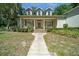 Charming home with a covered front porch, well-maintained lawn, and inviting walkway at 645 Sw 48Th Ln, Ocala, FL 34471