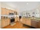 Open kitchen featuring stainless steel appliances and stone countertops at 645 Sw 48Th Ln, Ocala, FL 34471
