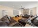 Inviting living room with stone fireplace, large screen, and ample seating at 645 Sw 48Th Ln, Ocala, FL 34471