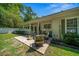 Outdoor patio with stylish seating and a fire pit, ideal for entertaining guests and enjoying evenings at 645 Sw 48Th Ln, Ocala, FL 34471