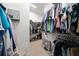 Spacious walk-in closet featuring custom shelving and hanging rods for storage at 645 Sw 48Th Ln, Ocala, FL 34471