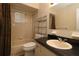 Clean bathroom features a shower and tub, as well as modern storage shelves and a sink at 6472 Sw 106Th Pl, Ocala, FL 34476