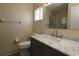 Bathroom with large vanity featuring a marble countertop and shaker-style cabinets at 6472 Sw 106Th Pl, Ocala, FL 34476