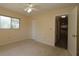 Bright bedroom with neutral walls, ceiling fan, closet and view to the next room at 6472 Sw 106Th Pl, Ocala, FL 34476