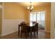 Open dining room with wainscoting, natural light, new floors and views of the Florida Room at 6472 Sw 106Th Pl, Ocala, FL 34476