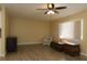 Bright and spacious living room features new floors, large window, chair and ceiling fan at 6472 Sw 106Th Pl, Ocala, FL 34476