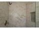Modern tiled shower with a built-in niche for toiletries providing ample storage at 6472 Sw 106Th Pl, Ocala, FL 34476