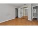 Clean bedroom with new wood-look vinyl plank and a mirrored closet at 6820 Se 108Th St, Belleview, FL 34420